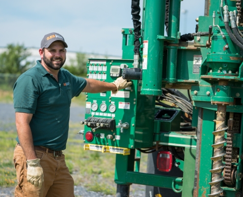 GES - 6-18-2014-1213 GES Employee Beside Drill Rig